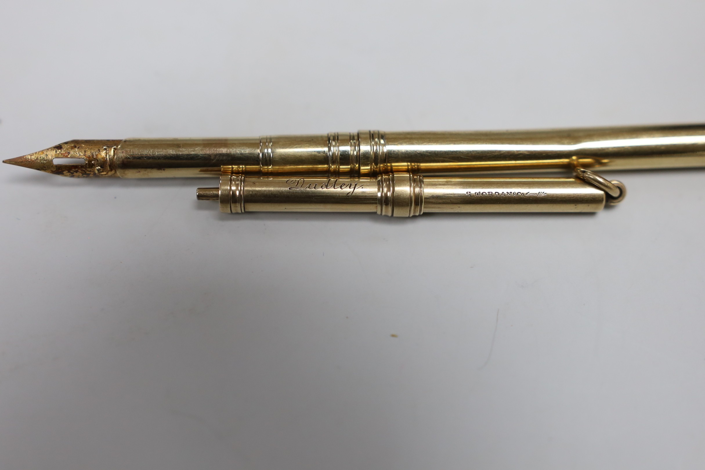 A George V 9ct gold dip pen by Sampson Mordan & Co, 12.4cm, 6.8 grams and a Sampson Mordan & Co yellow metal overlaid propelling pencil.